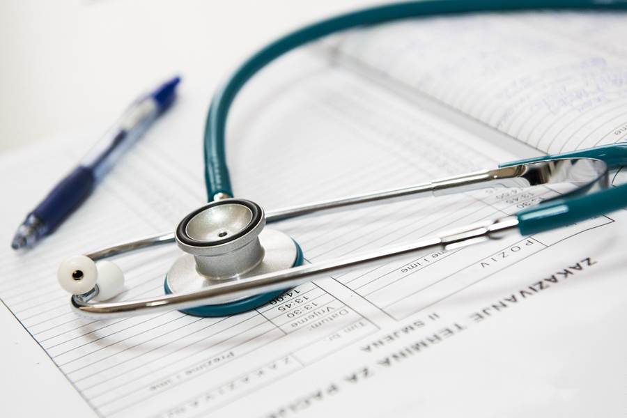 A stethoscope on a medical form

AI-generated content may be incorrect.